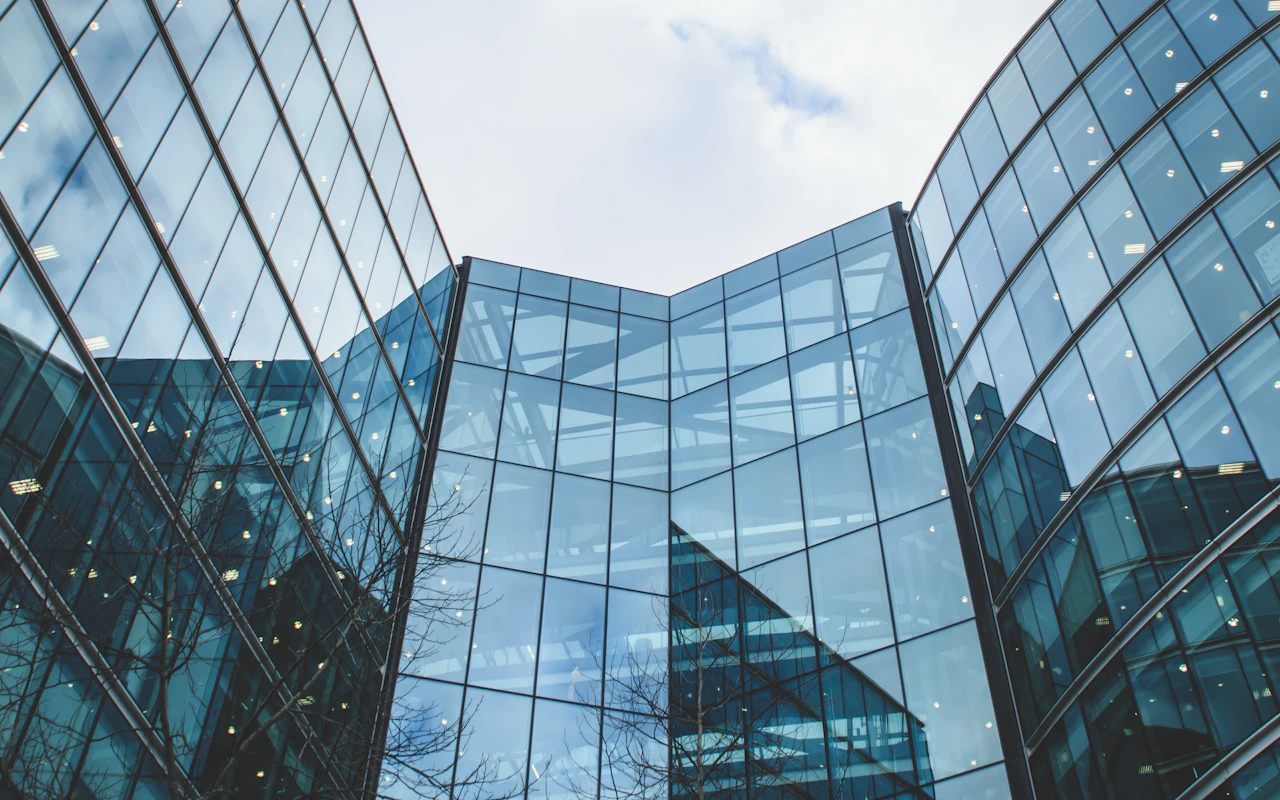Modern glass office towers seen from below