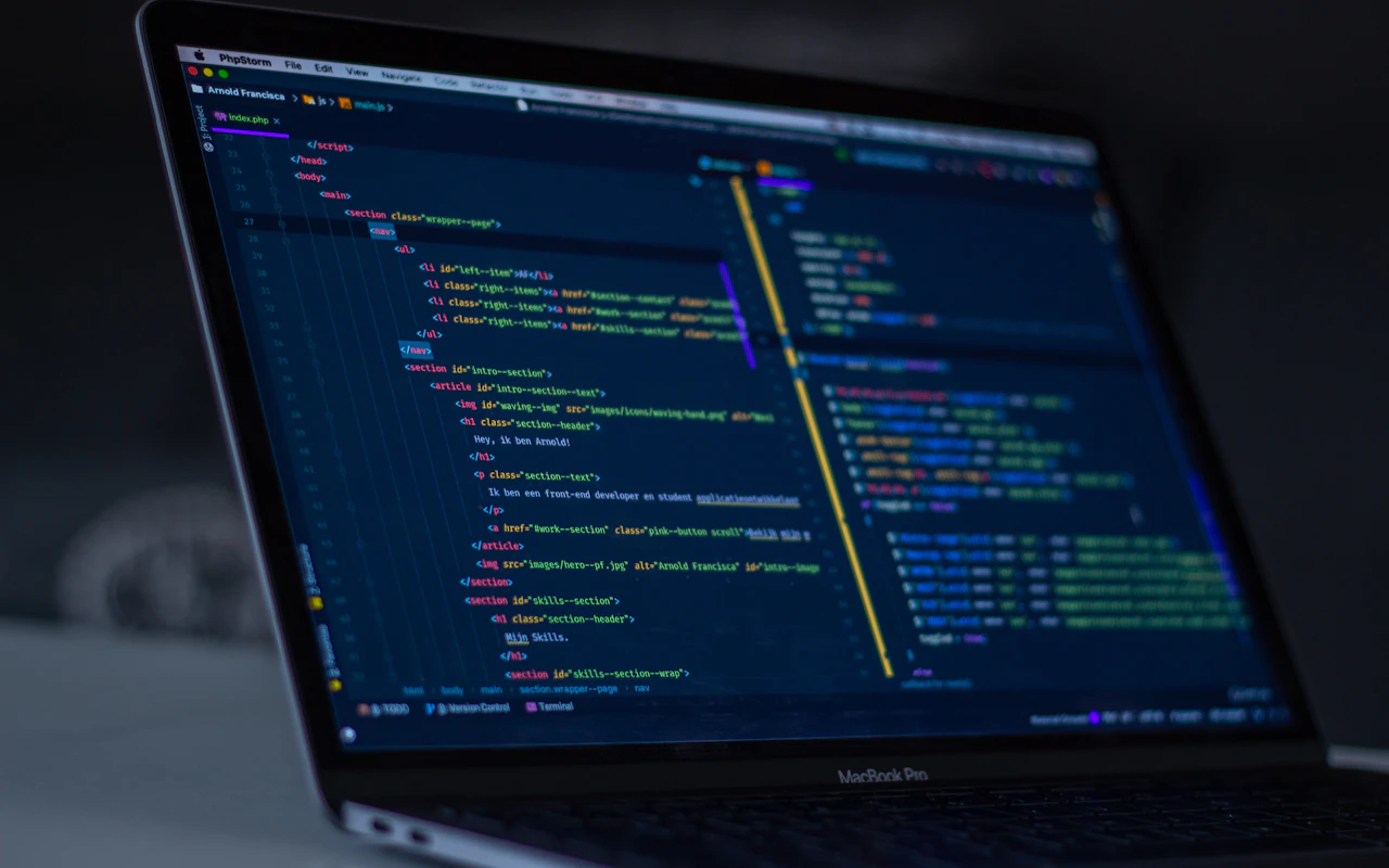 Code editor on a monitor in a minimal workspace